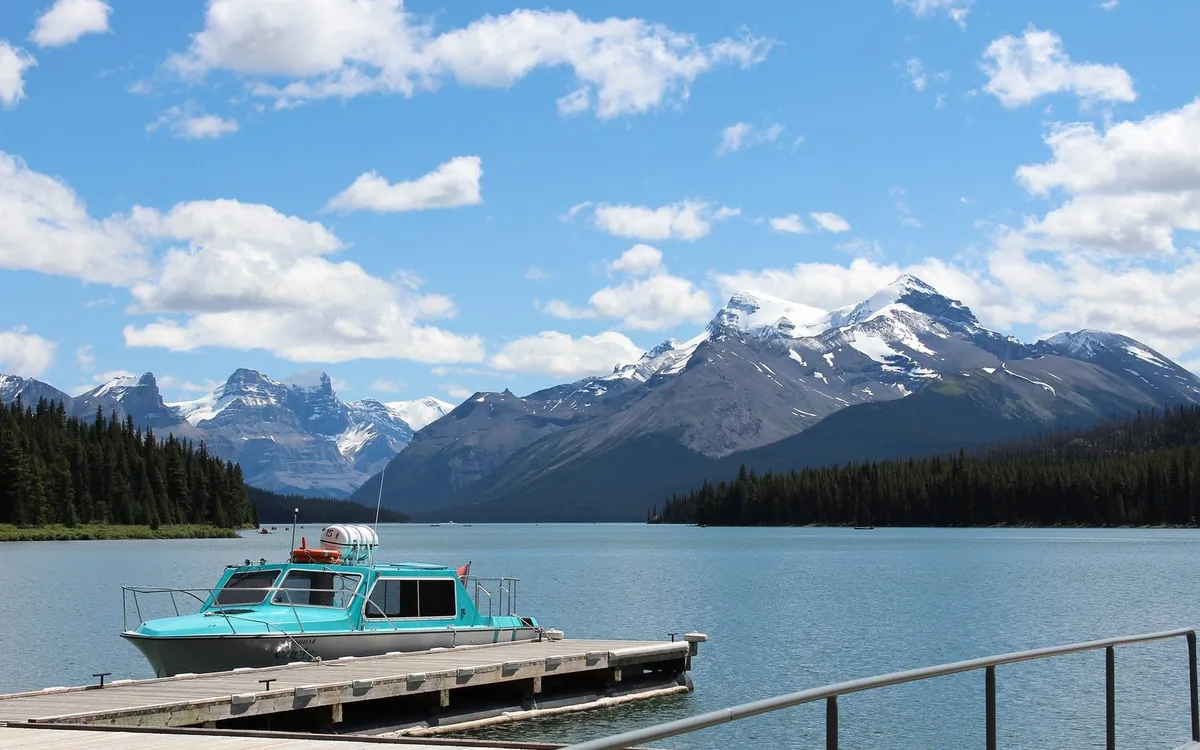 The cruise boat moored at the jetty on Maligne Lake