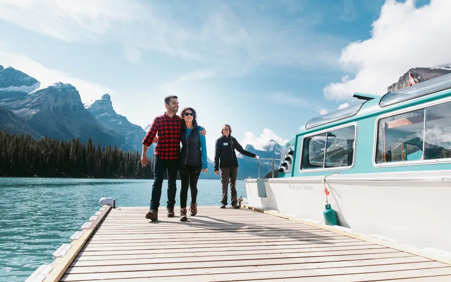 Passengers on the jetty beside the Maligne Lake cruise boat