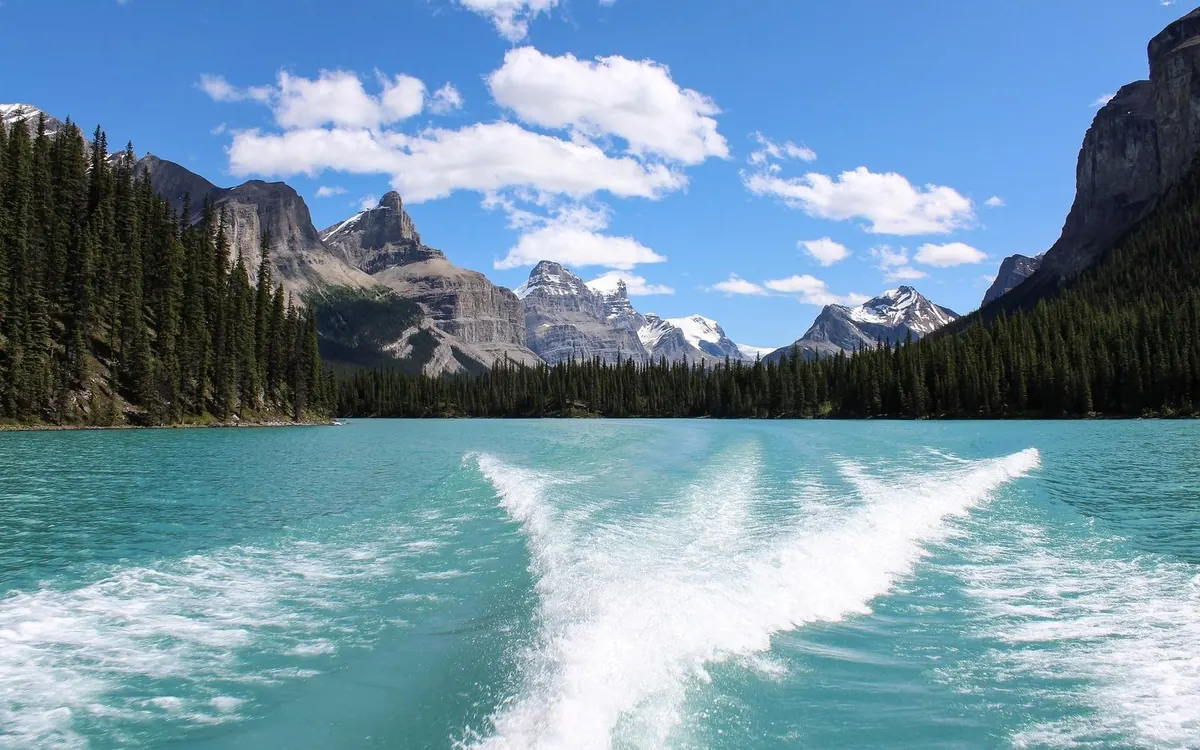 The wake of the cruise boat on Maligne Lake